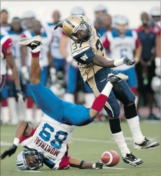  ?? Ryan Remiorz, Canadian Press ?? Montreal Alouettes receiver Travon Patterson, left, is tackled by Winnipeg Blue Bombers’ Demond Washington during CFL pre-season action Thursday in Montreal.