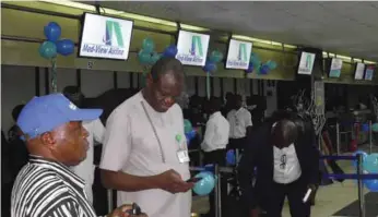  ??  ?? Staff of Med-View Airline attending to passengers at the Murtala Muhammed Internatio­nal Airport, during the airline's inaugural flights to Abidjan, Conakry and Dakar...recently