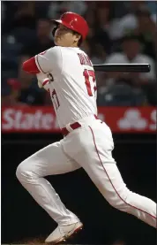  ?? Getty images ?? angels two-way star shohei ohtani hits a single against the red sox in the fifth inning on monday night in anaheim, calif.