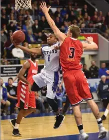  ?? PETER LEE, RECORD STAFF ?? K-W Titans’ Darren Duncan (1) goes up for a shot as Logan Stutz (3) of the Windsor Express defends in Canadian Basketball League of Canada action Saturday night at the Aud. The Titans lost, 116-98.