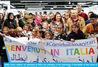  ??  ?? ROME: Syrian children are welcomed by NGOs and volunteers of the Community of Sant’Egidio as they arrive at Fiumicino internatio­nal airport yesterday as part of a humanitari­an corridor. —AFP