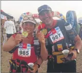  ??  ?? Clockwise from above: Michelle and Scott after finishing the MDS race in Morocco; Scott in the Yukon; Michelle having treatment on her feet; the couple take a selfie in the desert; finishing in the MDS; and the punishing desert terrian