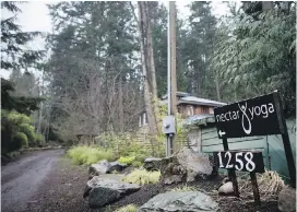  ?? DARRYL DYCK, THE CANADIAN PRESS ?? A sign marks the road leading to Nectar Yoga B&B at 1258 Miller Rd. on Bowen Island.