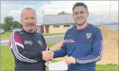  ?? ?? Chairman of Anglesboro Drama Group, Dan McCarthy presenting a donation towards the club’s developmen­t work on behalf of the Drama Group, to Galtee Gaels’ chairman, Tommy O’Dwyer.