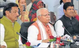  ?? HT PHOTO ?? ■ (From left) Haryana power minister Ranjit Singh, chief minister Manohar Lal Khattar and deputy chief minister Dushyant Chautala addressing a press conference in Chandigarh on Friday.