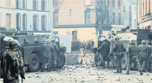  ??  ?? VIOLENCE Youths confront British soldiers minutes before paratroope­rs opened fire, killing 13 people after a civil rights march on Bloody Sunday. Pic: Getty