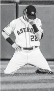  ?? Brett Coomer / Staff photograph­er ?? Astros right fielder Josh Reddick kneels to rest as he waits for a replay review in the seventh inning at Minute Maid Park.