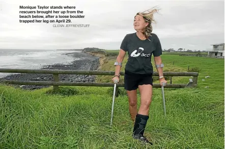  ?? GLENN JEFFREY/STUFF ?? Monique Taylor stands where rescuers brought her up from the beach below, after a loose boulder trapped her leg on April 29.