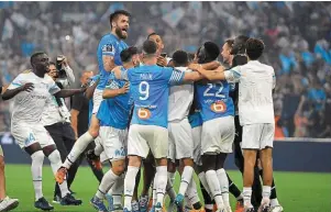  ?? | PHOTO : AFP ?? La joie des Marseillai­s qualifiés pour la prochaine Ligue des champions.