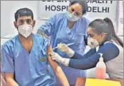  ?? RAJ K RAJ/HT PHOTO ?? A health worker receives a Covishield vaccine jab at Rajiv Gandhi Super Speciality Hospital.
