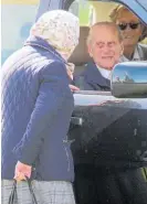  ??  ?? Her Majesty The Queen stops for a chat with her husband through the window of his Range Rover at the 2018 Pony Club Games.
