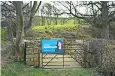  ??  ?? A campaign poster for Tory candidate Trudy Harrison on a gate in rural Cumbria