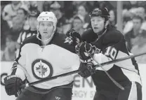  ?? VINCENT PUGLIESE/ GETTY IMAGES ?? Within a span of four days, the Pittsburgh Penguins acquired Brenden Morrow, right ( shown with Winnipeg Jets’ Ron Hainsey), along with Jarome Iginla and Doug Murray.