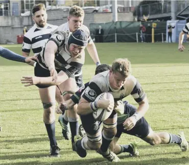  ??  ?? 0 Captain Iain Wilson charges over to secure the victory for Heriot’s and also the four-try bonus point.