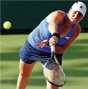  ??  ?? Looking good: Russia’s Alisa Kleybanova hitting a return to Sweden’s Johanna Larsson during their first round match at the ATP & Miami Hardcourt Tournament on Tuesday. — AFP