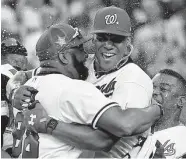  ?? Kevork Djansezian/Getty Images ?? Nationals star Juan Soto, center, held off Mariners rookie Juan Rodriguez 19-18 in the final Monday night.