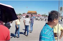  ??  ?? Mr Rocky, our tour guide, says the crowd at Tiananmen Square is an economic indicator