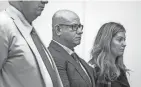  ?? BROOKE LAVALLEY/COLUMBUS DISPATCH ?? Columbus police officer Demetris Ortega, center, stands with his defense attorneys, Mark Collins and Kaitlyn Stephens, Thursday in Franklin County Common Pleas Court.