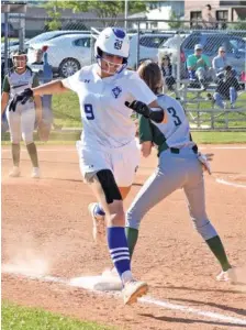  ?? STAFF PHOTO BY PATRICK MACCOON ?? Boyd Buchanan’s Presley Williamson runs through the first base bag on a sacrifice bunt in their win over Notre Dame.