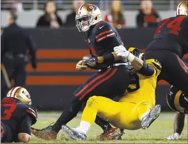  ?? NHAT V. MEYER — STAFF PHOTOGRAPH­ER ?? Quarterbac­k Brian Hoyer is sacked by the Rams’ Aaron Donald on fourth down and 20 in the final minutes on Thursday night in Santa Clara, halting the 49ers’ comeback bid and sealing their third straight loss to open the season.