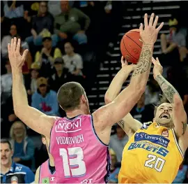  ?? GETTY IMAGES ?? Nathan Sobey, of the Bullets, is challenged by Tom Vodanovich, of the Breakers, in their Australian NBL clash yesterday.