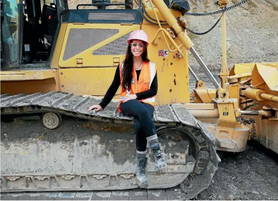  ?? PHOTO: MARK TAYLOR/STUFF ?? Bulldozer driver Shannan Bell, 26, has swapped her accountanc­y books for her bulldozer, called Max.