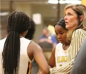  ?? (Pine Bluff Commercial/I.C. Murrell) ?? Leslie Henderson, shown in a timeout with her Watson Chapel team during a January 2023 game, won five state basketball and five state track and field championsh­ips in her career.