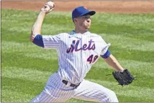  ?? KATHY WILLENS — THE ASSOCIATED PRESS ?? New York Mets starting pitcher Jacob deGrom winds up during the second inning of a baseball game against the Philadelph­ia Phillies, Sunday, Sept. 6, 2020, in New York.