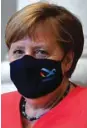  ??  ?? Merkel: had been quizzed earlier in the week on why she hadn’t been seen more often with her mouth and nose covered as required under coronaviru­s rules.