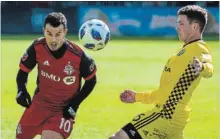  ?? EDUARDO LIMA METRO NEWS ?? Toronto FC star Sebastian Giovinco vies with Columbus midfielder Wil Trapp during an MLS match Saturday. Toronto FC lost, 2-0.