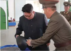  ??  ?? NORTH KOREAN leader Kim Jong Un looks on during a visit to the Chemical Material Institute of the Academy of Defense Science in this undated photo released by the Korean Central News Agency in Pyongyang yesterday.