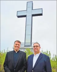  ?? Contribute­d photo ?? Fr. James Sullivan, organizer of the Holy Land Mountainto­p Mass, joins Chuck Pagano, chairman of Holy Land USA, at the cross in Waterbury where the Mass will be held Aug. 11.