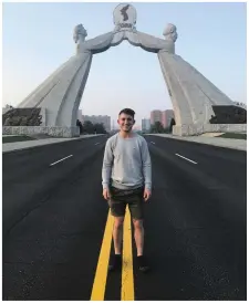  ??  ?? BELOW: The 22-year-old from Castlegreg­ory stands on an empty road, with the Arch of Reunificat­ion in the background.