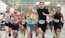  ?? CLIFFORD SKARSTEDT EXAMINER ?? Runner Josh Plant (146), left, was the 10k winner on Sept. 10, 2016 during the Merrett Home Hardware Run For Mental Health downtown.