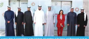  ?? ?? A group photo of representa­tives of the Gulf Bank and members of the Dahiya and Mansouriah co-op societies with Ahmad Al-Amir and Ahmed Al-Rashed Al-Khaleej in the center.
