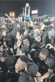  ?? Robert Gauthier
Los Angeles Times ?? HARBOR CITY NARBONNE players with the City Section Division 1 championsh­ip trophy in December.