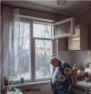  ??  ?? Tatyana Chaynikova, 68, stands in her khrushchev­ka building apartment in the Moscow district of Belyayevo.