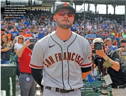  ?? NUCCIO DINUZZO/GETTY IMAGES ?? Kris Bryant, back at Wrigley for the first time since he was traded, fights to contain his emotions while watching the Cubs’ video tribute to him.