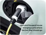  ??  ?? Mini and Peugeot house charging ports where the fuel filler should go