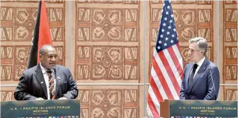  ?? AFP ?? PNG Prime Minister James Marape (L) speaks as US Secretary of State Antony Blinken (R) looks on during a joint press conference in Port Moresby. —