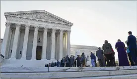  ?? SUSAN WALSH / AP ?? People stand in line Monday to get into the Supreme Court on the first day of the new term. Justice Neil Gorsuch started his first full term on the bench.