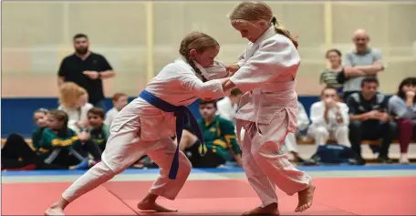  ??  ?? Ciara Forde of SPA Mucross, Co. Kerry, right, and Kathleen Ryan of Kilteely - Dromkeen - Garydoolis, Co. Limerick, competing in the Judo - 26Kg U16 &amp; O6 Girls event during day one of the Aldi Community Games August Festival at the University of Limerick in Limerick.