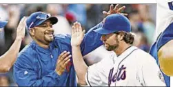  ??  ?? R.A. Dickey gets hand from King of Citi Johan Santana after punching out Cards with own shutout. Howard Simmons/ News