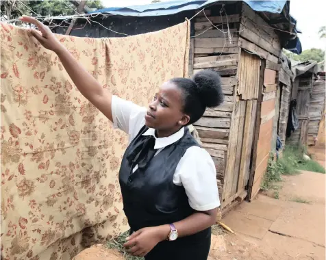  ?? ZANELE ZULU African News Agency (ANA) ?? TWENTY-four-year-old Athini Siyongo studies hospitalit­y at eThekwini College in Mayville, Durban. She stays in the informal settlement because her institutio­n does not offer accommodat­ion. |