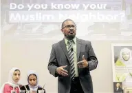  ??  ?? Kamal Elmekki, an imam from Clear Lake Islamic Center, answers questions and discusses misconcept­ions about Muslims and Islam.