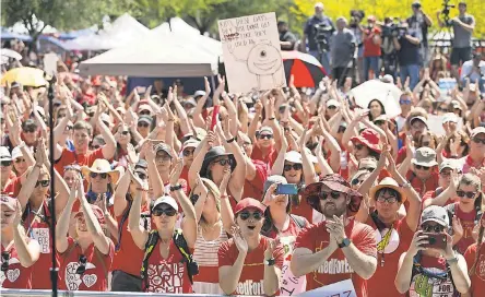  ?? DAVID WALLACE/ARIZONA REPUBLIC ?? Teachers and supporters hold a #RedForEd rally at the Arizona Capitol in Phoenix on Friday.