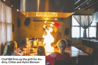  ??  ?? Chef BB fires up the grill for Audrey, Chloe and Aylce Benson