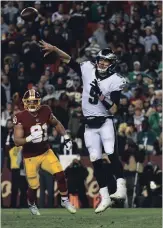  ?? TONI L. SANDYS THE WASHINGTON POST ?? New Orleans Saints Drew Brees and Philadelph­ia Eagles Nick Foles, both Super Bowl MVPs, attended the same Texas high school and will meet in the NFL Divisional Playoffs Sunday.