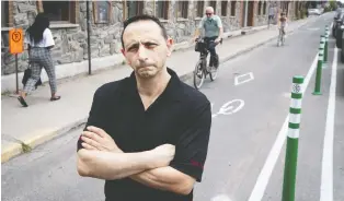  ?? ALLEN MCINNIS ?? Franco De Lauri of Elio on Bellechass­e St. in Rosemont–la Petite-patrie is upset that the city widened an existing bike lane and created a new one across the street, which eliminated parking for his clientele.