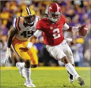  ?? KEVIN C. COX / GETTY IMAGES ?? Edge rusher Arden Key (left), who played at Martin Luther King Jr. High in Lithonia, should be LSU’s top defensive player in the NFL Draft.